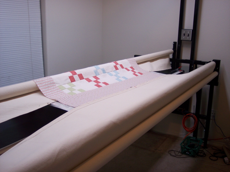 Step by step loading the back of a quilt on a longarm quilting frame